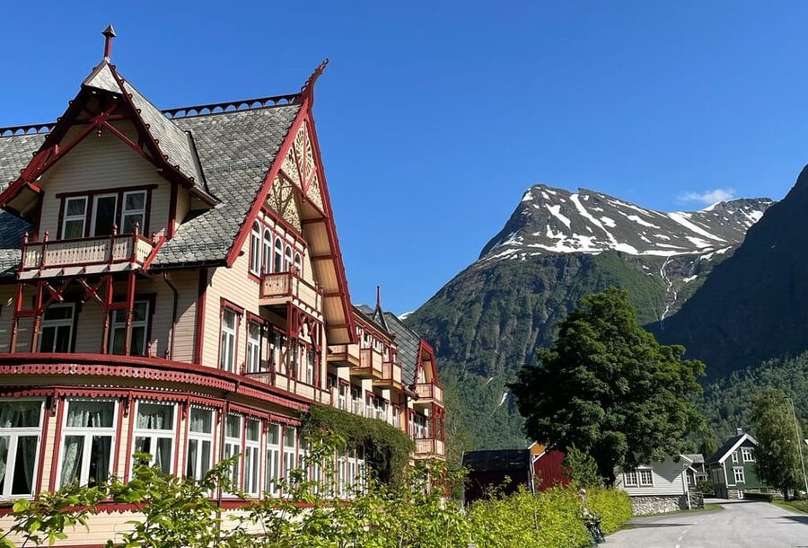 All About the Fjords, in one tour by boat & bus from Ålesund - Hellesylt: cafés, shops, and the waterfall that runs through town