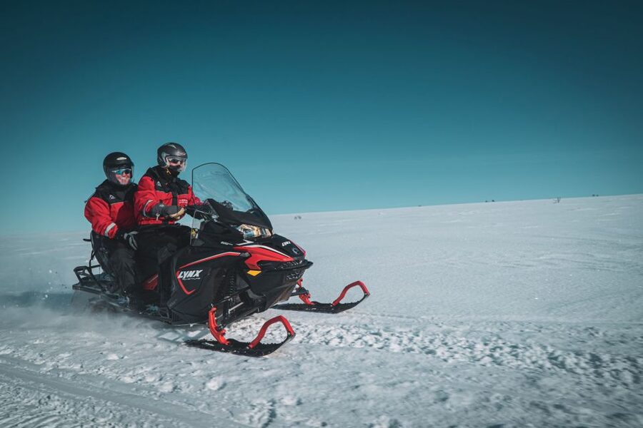 From Alta: Daytime Snowmobile Adventure - The warm lodge stop, local snacks, and hot drinks