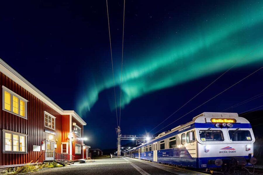 From Narvik: The Northern Lights Arctic Train Guided Tour - Katterat station stop: campfire, lavvu shelter, and old mountain life