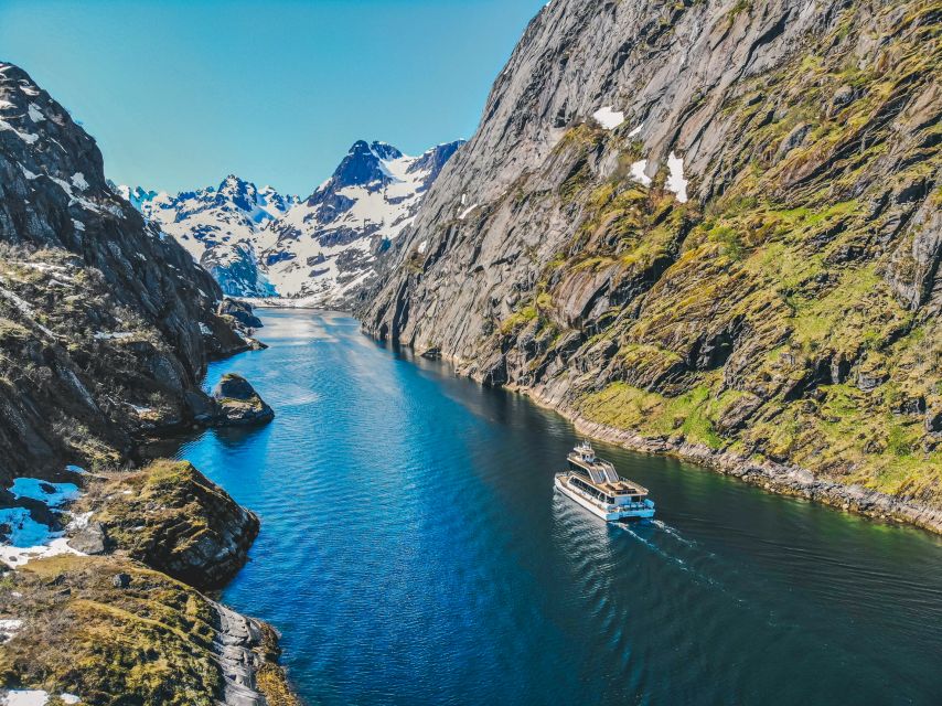 A cruise boat under the cliffs of the Trollfjord, Lofoten