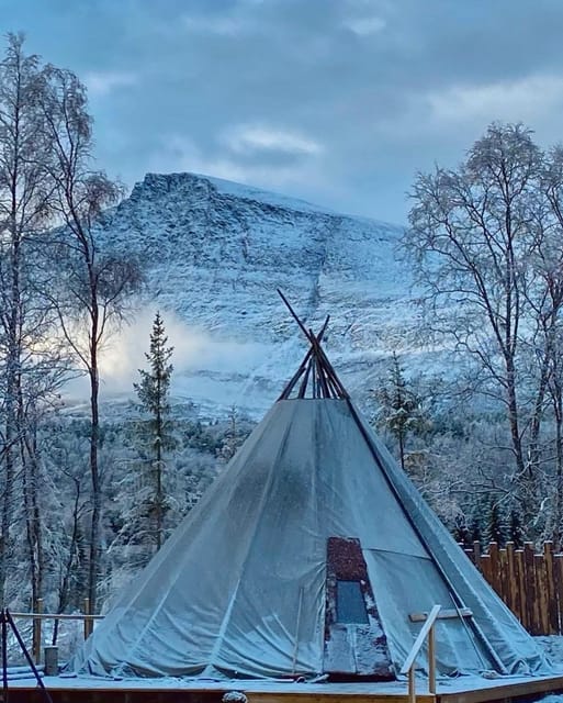 From Tromso: Arctic Wilderness Snowmobile Daytime Tour - From Magic Ice Bar Tromsø to Lyngskroa: your winter day starts with the bus