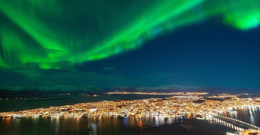 From Tromsø: Evening Fjellheisen Snowshoe Hike and Cable Car - The mountain café reset: hot drink, pastry, and a breather
