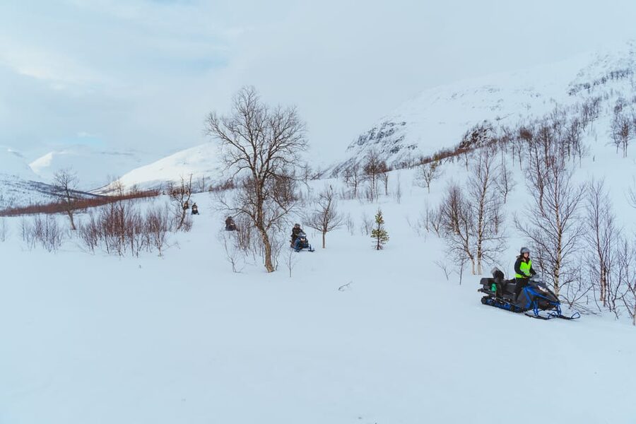 From Tromsø: Snowmobiling Tour at Camp Tamok - On snow: your shared snowmobile adventure through mountains and frozen water