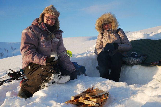 Snowshoeing With A View - The fire, the grill cabin, and the included meal that makes the day feel complete