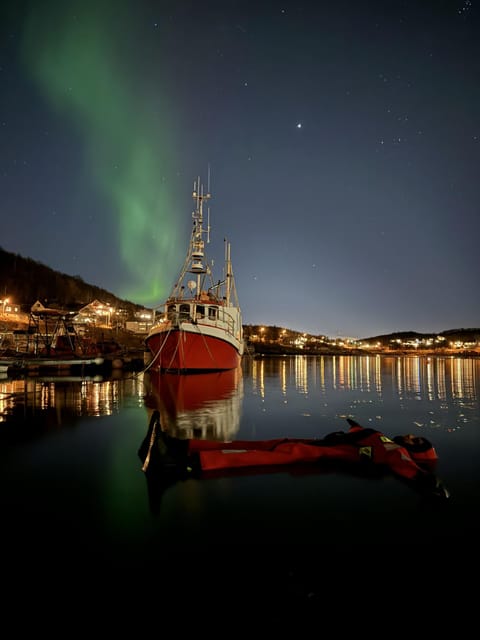 Tromsø: Arctic Fjord Floating in Survival Suit - In the water: floating, swimming coaching, and jump options