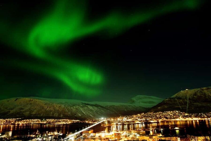 Tromsø: Evening dinner cruise with possible northern lights - MS Tromsø at dusk, and why staying aboard matters