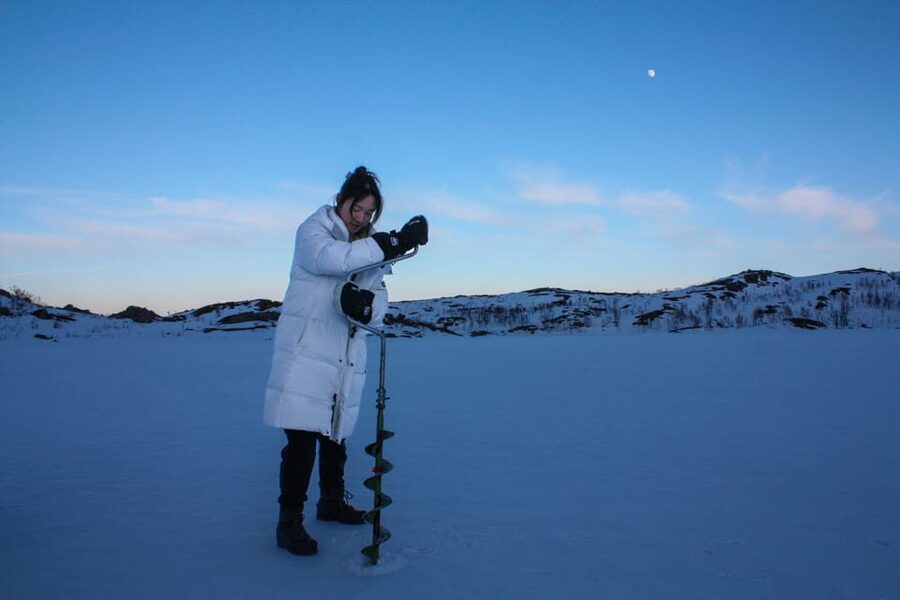Tromsø: Ice Fishing and Snowshoe Hiking with a Local Guide - Getting lucky with trout, and the choice about eating it