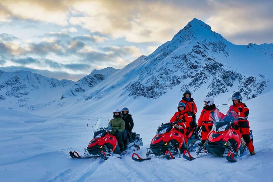 Tromsø: Lyngen Alps Guided Snowmobile Tour - Gear up at Aurora Wonderland Basecamp, then learn fast