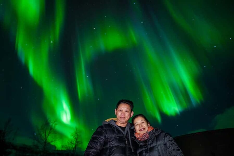 Tromsø: Unlimited Northern Lights Chase Across Borders - What you get included: thermal overalls, warm drinks, and photo delivery